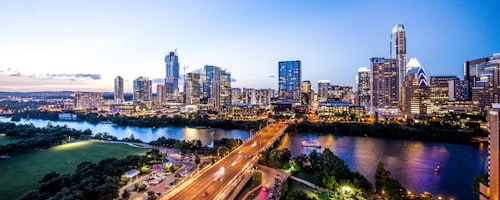 Agency owner reviewing client portfolio in San Antonio office